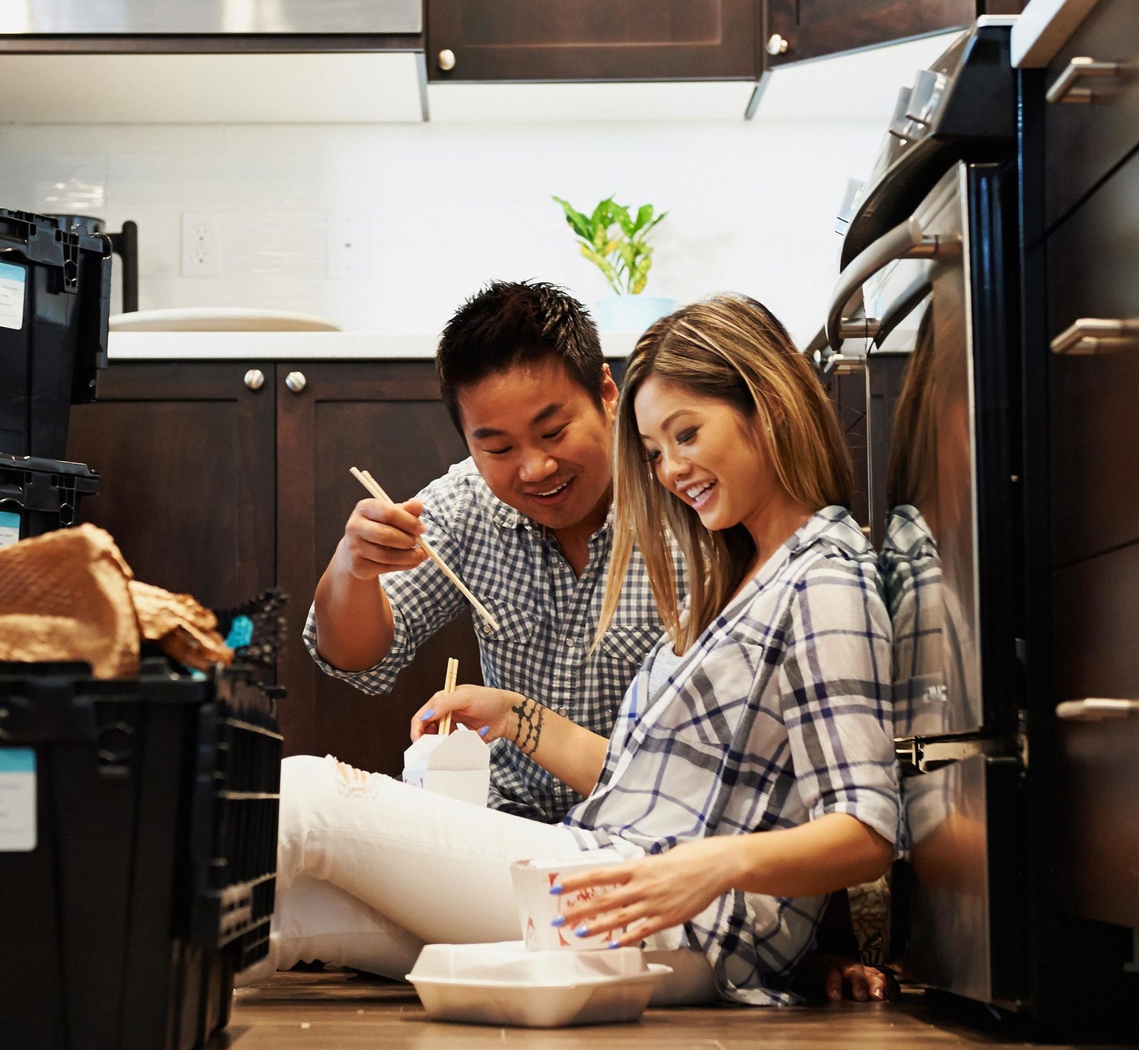 Couple Sitting on the Floor Eating